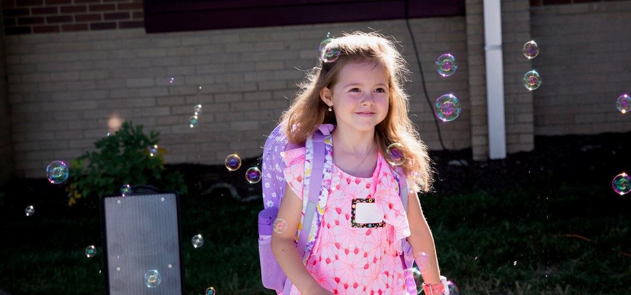 student with bubbles