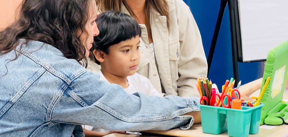 Lions Park student receiving teacher support.