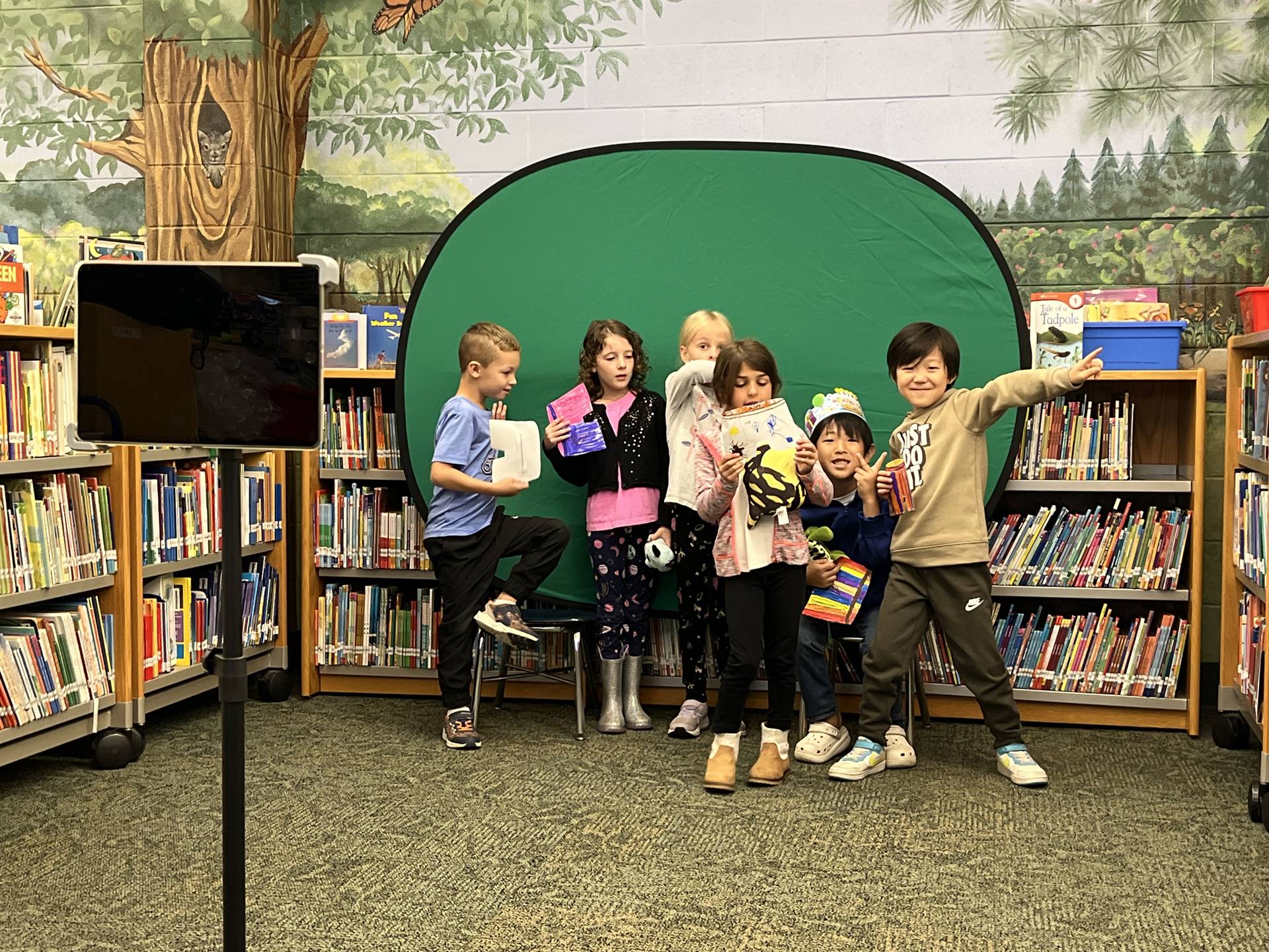 1st grade students engaged in videography project.